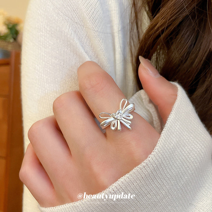 Silver Open Bow Ring With Heart Clear Crystal Center