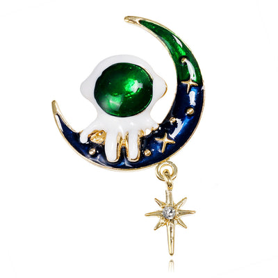 Front product view of the moon brooch pin in black and gold