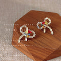Gold Tone Crystal Pave Bow Studs Multicolor Center Stones view 2