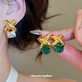 Gold Tone Crossed Bar and Cube Drop Earrings in Two Colors view 2