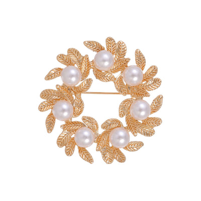 Front product view of the gold leaf and pearl brooch