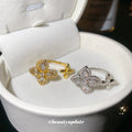 Open Four-Petal Zircon Flower Rings Gold and Silver view 2