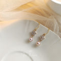 Gold Tone Clear Stone Snowflake And Pink Pearl Hook Earrings view 4