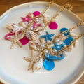Ocean Charm Necklace With Shells Starfish and Pink or Blue Accents view 4