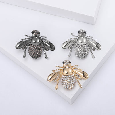 Front view of a rounded bee with crystal wings and a central pearl body