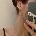Large Slim Textured Hoop Earrings in Gold and Silver Tones view 2