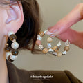 Brown And White Beaded Hoop Earrings In Two Patterns view 2