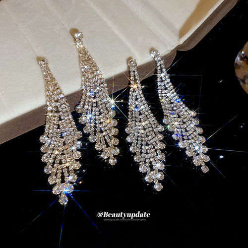 Crystal Waterfall Tassel Earrings in Gold and Silver shown in a styled or display view