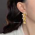 Gold Cascading Triple Flower Long Drop Earrings Pair view 2