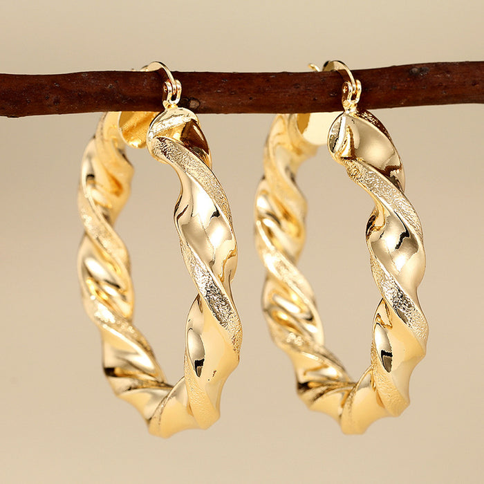 Gold Tone Twisted Open Hoop Earrings With Sculpted Texture