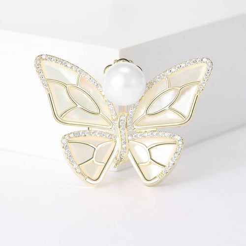 Silver pearl butterfly brooch close-up of shell wings