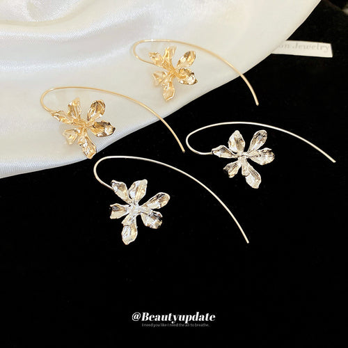 Gold Iris earrings in close view