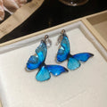 Blue Butterfly Drop Earrings in Clip On and Hook Styles view 6