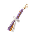 Gold Tone Woven Daisy Bow Tassel Clip Keychains in Four Colors view 5