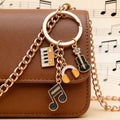Yellow-Led Guitar Piano Violin and Headphone Charm Keychain Collection view 1