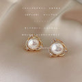 Gold Tone Crossed Circle White Pearl And Clear Stone Stud Earrings view 3