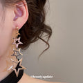 Gold Tone Open Star Long Cascade Statement Dangle Earrings view 4