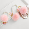Pink Faux Fur Pom Keychain with Pearl Strand and Glitter Flower Charm view 1