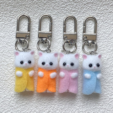 Flocked White Cat Clip Keychains in Nine Outfit Colors