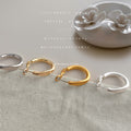 Round Huggie Hoop Earrings In Gold Silver Polished And Matte view 1