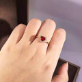 Red Heart-Shaped Solitaire Halo Ring In Polished Gold Tone view 3
