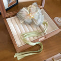 Gray Green Translucent Bow Hair Claw With Pearl Like Center And Ribbon Tails view 6
