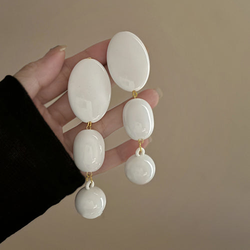 Product image 1 showing a cascade of smooth white oval shapes in graduated sizes