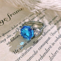 Silver Tone Octagonal Blue Stone Ring With Clear Side Stones view 4
