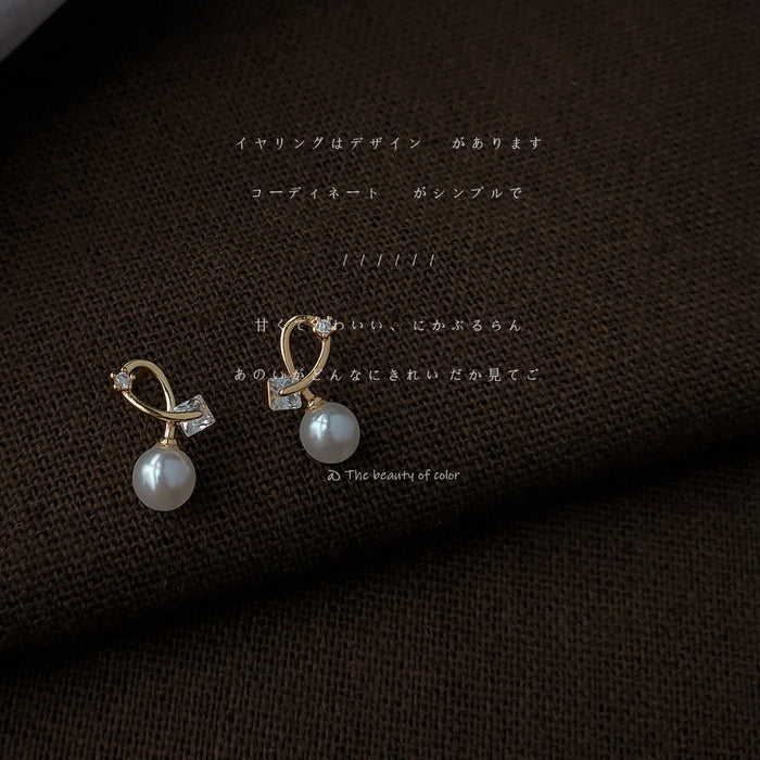 Gold Tone Twisted Loop And White Pearl Drop Stud Earrings For Women
