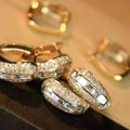 Gold Tone Baguette Crystal Pave Huggie Earrings view 2