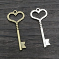 Long Heart Bow Key Pendants in Two Antique Metal Finishes view 1