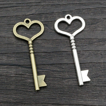Long Heart Bow Key Pendants in Two Antique Metal Finishes