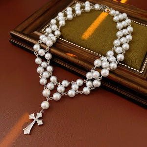 Product image 1 showing a white pearl strand ending in a silver tone crystal cross