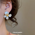 White Flower Stud Earrings with Gold Tone Centers with Decorative Details view 3