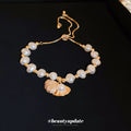 Gold Tone Irregular Pearl Like Slider Bracelet With Shell Charm view 1