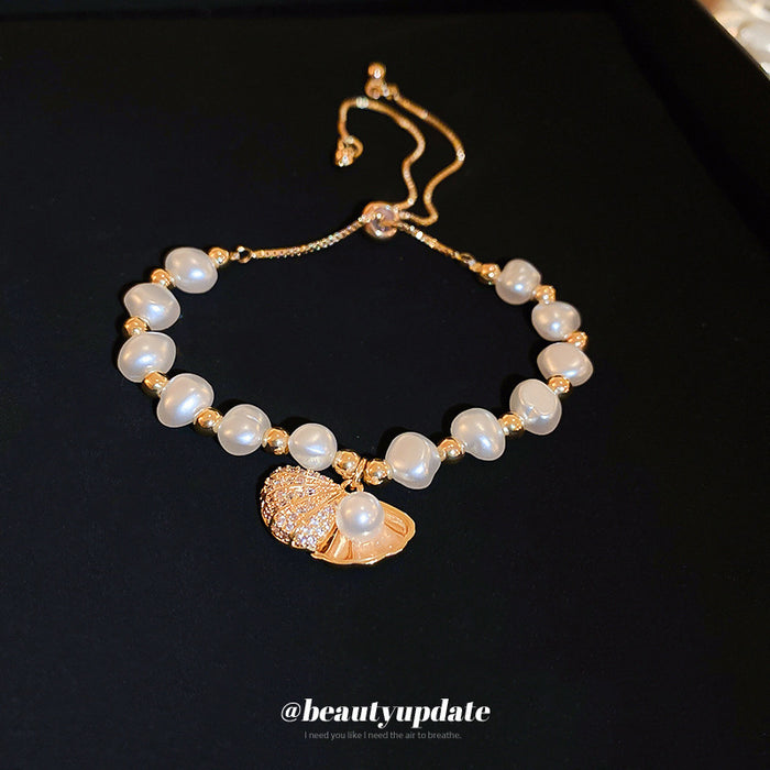 Gold Tone Irregular Pearl Like Slider Bracelet With Shell Charm
