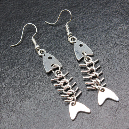 Alternate angle of jointed fish skeleton earrings showing jointed fish skeleton drops on fishhook ear wires