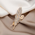 Gold Rhinestone Feather Brooch Pin With Cutout Leaf Detail view 1