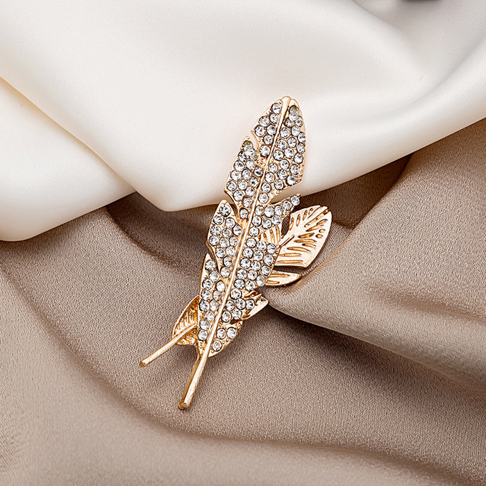 Gold Rhinestone Feather Brooch Pin With Cutout Leaf Detail