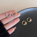 Crystal Huggie Hoop Earrings in Gold and Silver Tones view 2