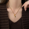 Gold Tone Gourd Pendant Necklace With Brown Stone Pendant Jewelry view 1