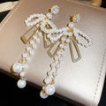 Bow and Pearl Like Bead Tassel Earrings in Gold Tone view 6