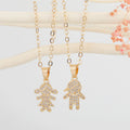 Gold Tone Crystal Boy and Girl Figure Pendant Necklaces view 1