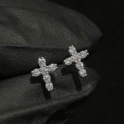 Additional product view showing clear stone cross stud earrings in gold and silver tones