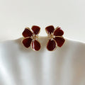 Deep Red Enamel Four Petal Flower Stud Earrings in Gold Tone view 1