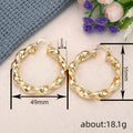 Gold Tone Twisted Open Hoop Earrings With Sculpted Texture view 4