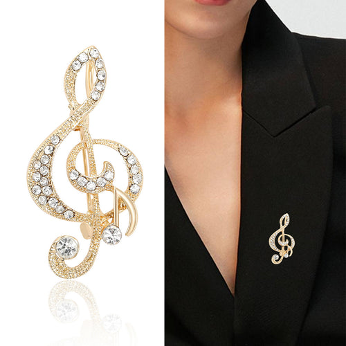 Angled close-up showing crystals on the crystal treble clef brooch