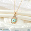 Gold Tone Crystal Teardrop Evil Eye Necklace and Earring Options view 6