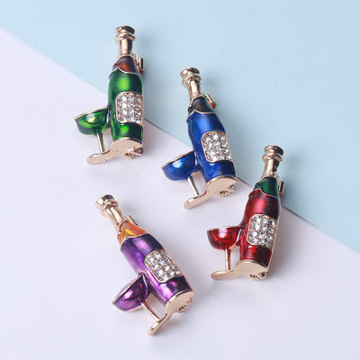 Front view of enamel wine bottle paired with a crystal accented wine glass