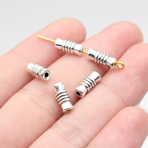 Wrapped Coil Tube Metal Spacer Bead hand-held front view